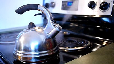 stock footage boiling kettle lets out steam